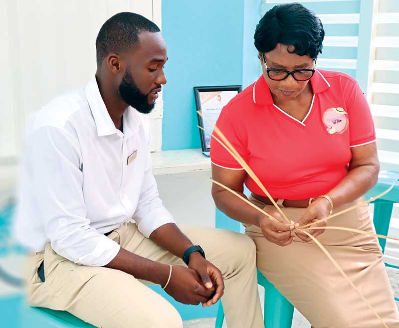 A local artisan sharing her handcraft knowledge with a guest